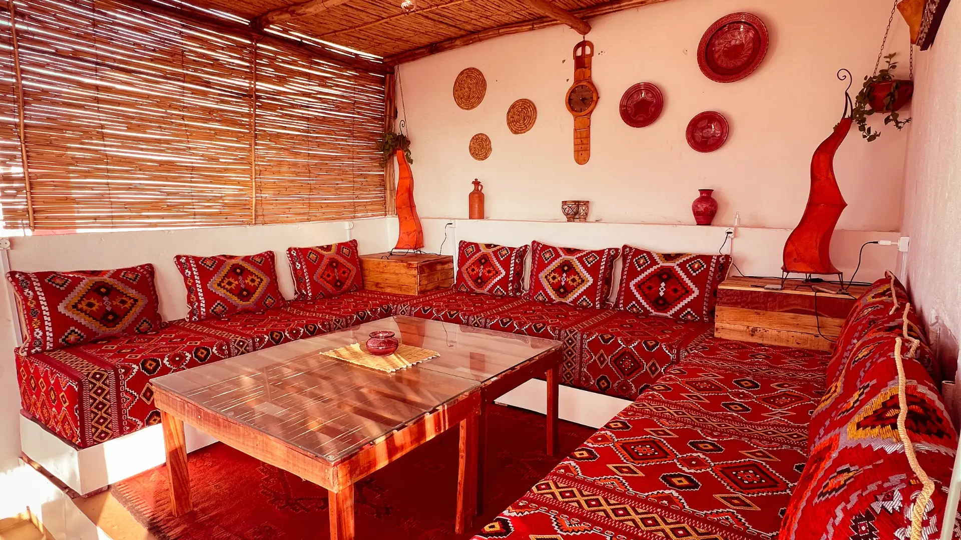 Warm Moroccan-inspired interior with wooden furniture and woven textiles
