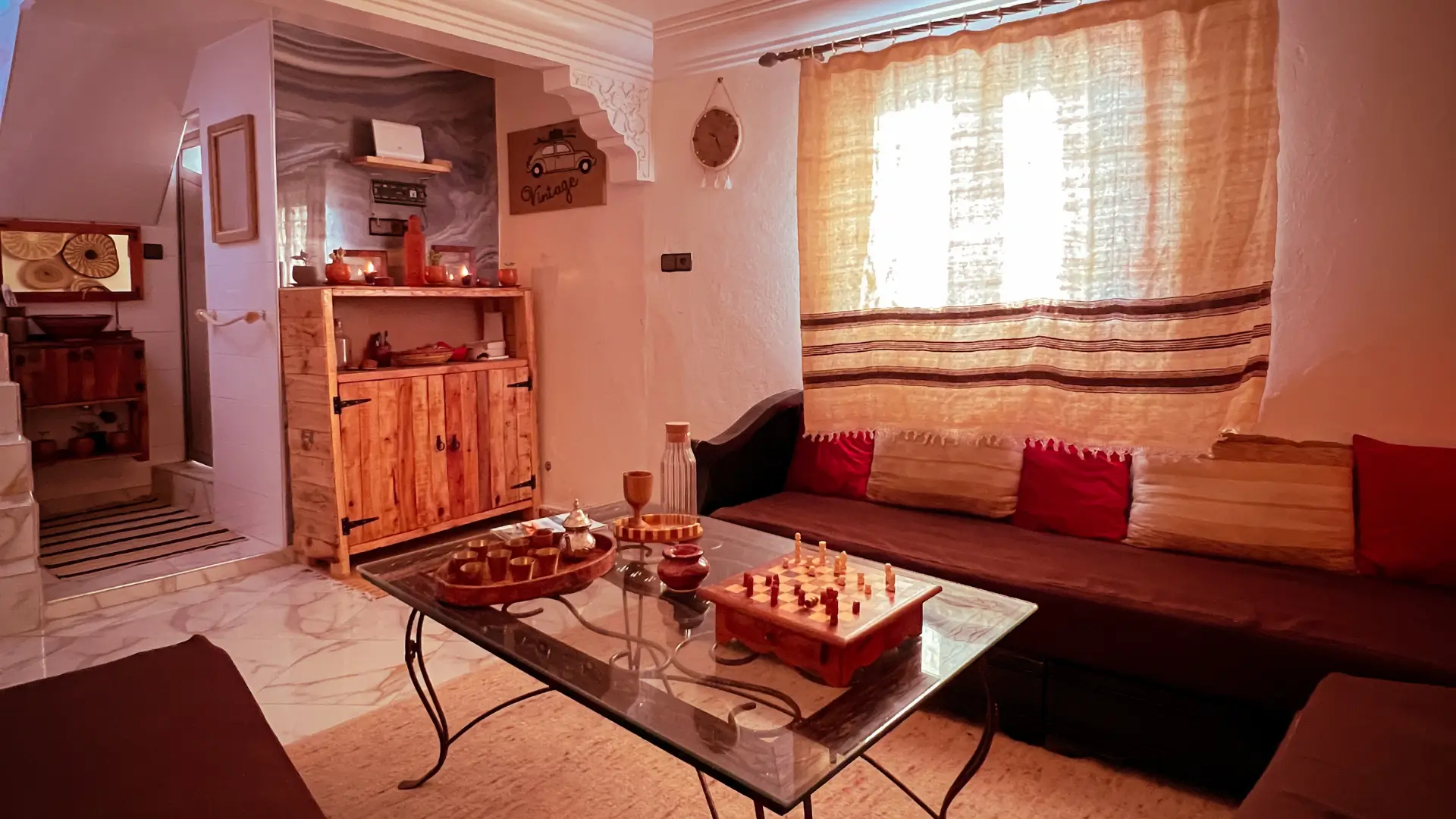 Shared living space at Vagusta Reset with wooden seating and a low table